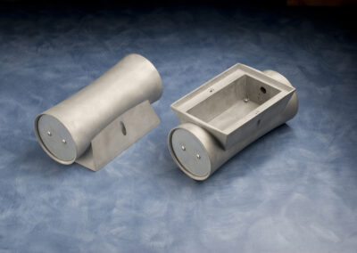 Metal casting in a light gray finish.